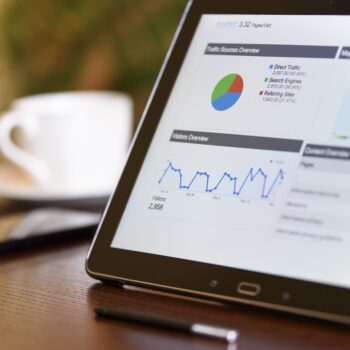 Tablet on desk showing an analytics dashboard referring to the i2 Analyst Notebook & iBase Training