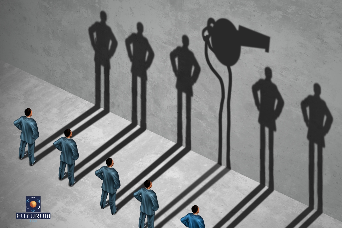 Infographic of employees standing in front of a concrete wall, casting shadows where one shadow depicts one of the employees as a whistle blower with a whistle shaped shadow